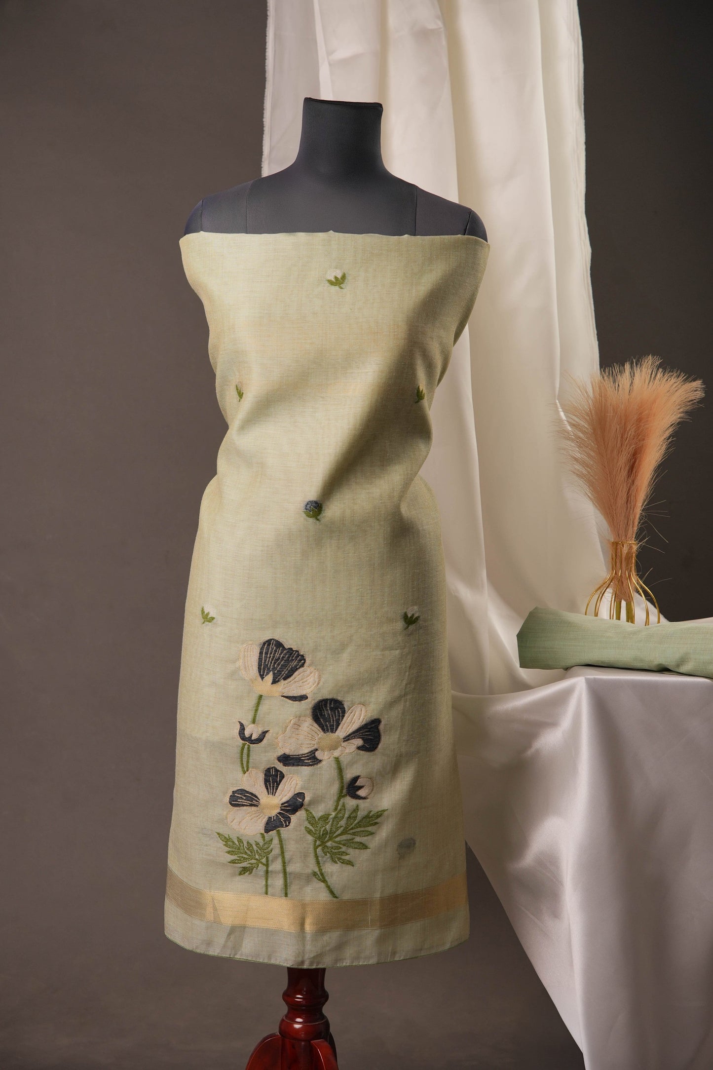 Pista Green Muga Cotton Unstitched Suit with Black Floral Weaving & Tassel Dupatta