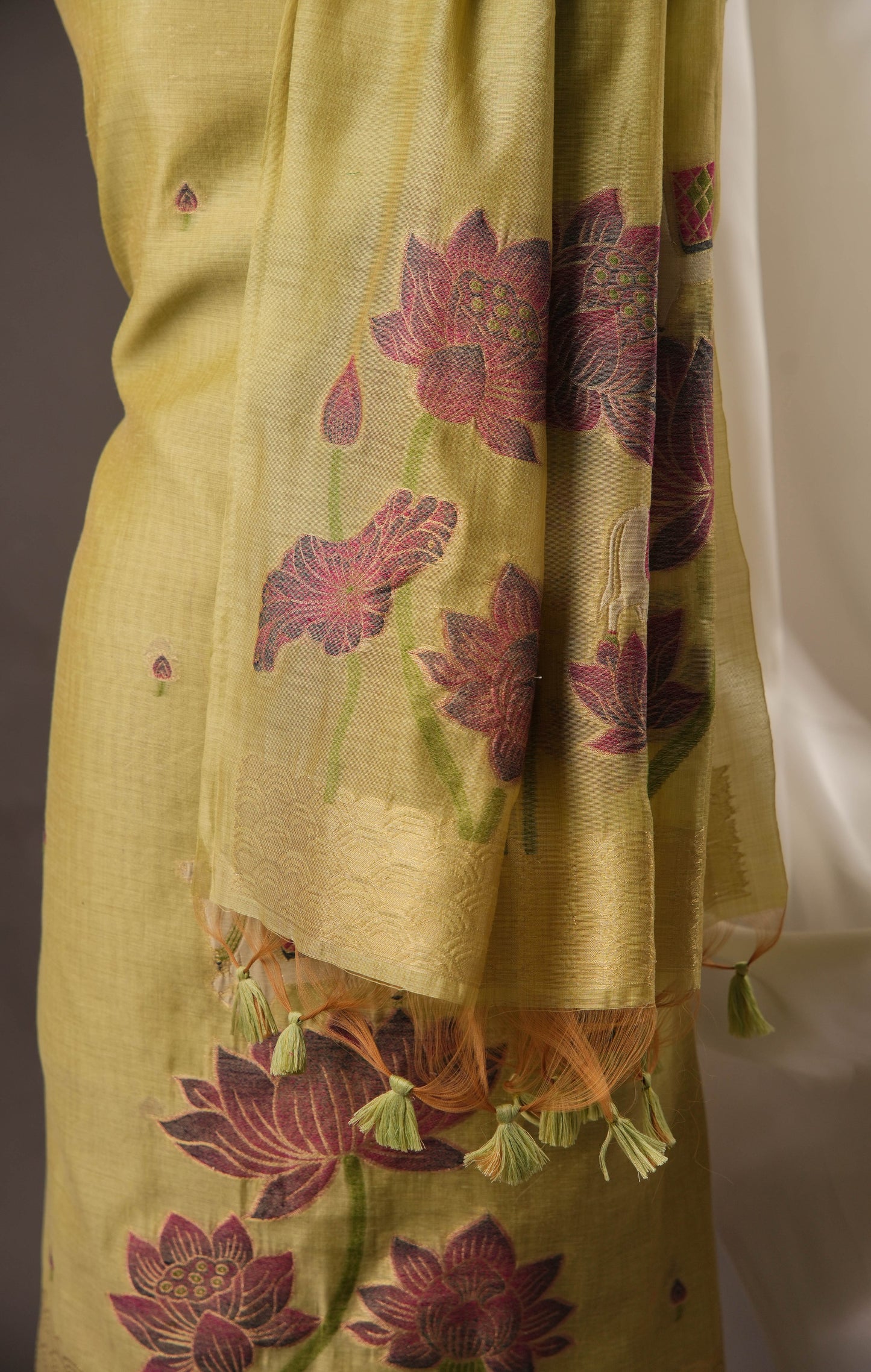 Lotus Floral Pista Green Muga Cotton Unstitched Suit with Lotus & Cow Weaving and Tassel Dupatta