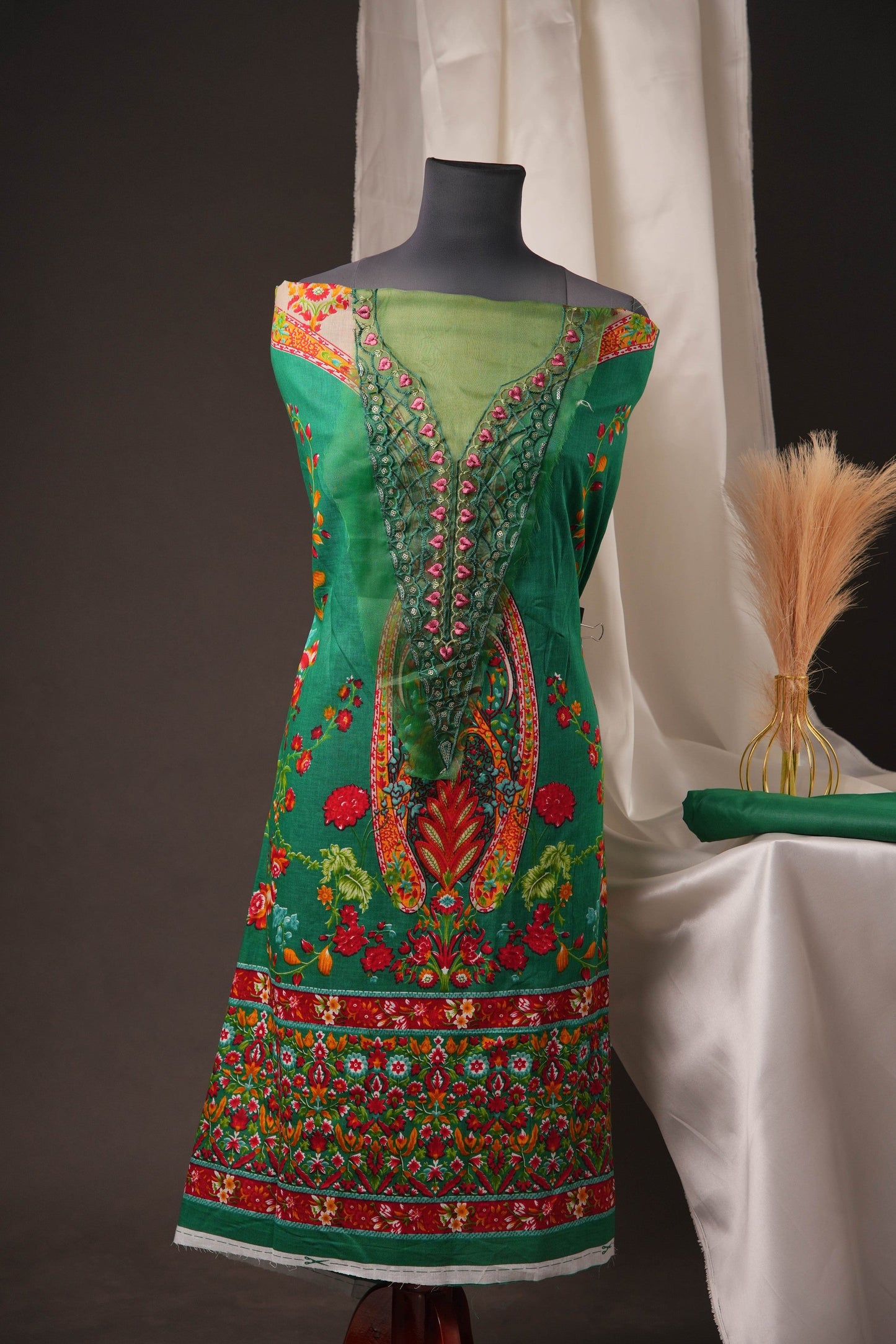 Green Pakistani Unstitched Suit with Embroidered Neck Patch & Puff Sleeve.