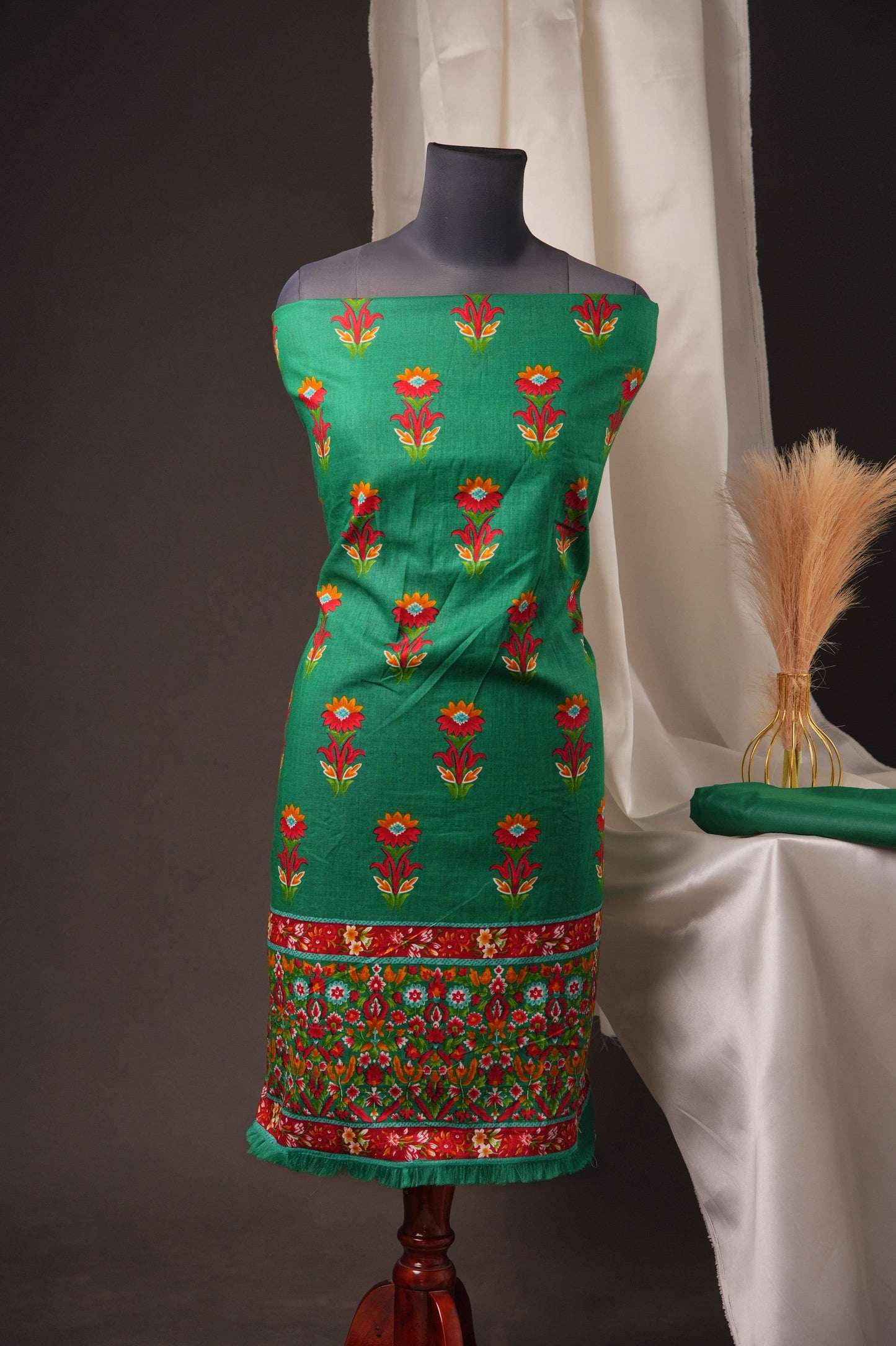 Green Pakistani Unstitched Suit with Embroidered Neck Patch & Puff Sleeve.