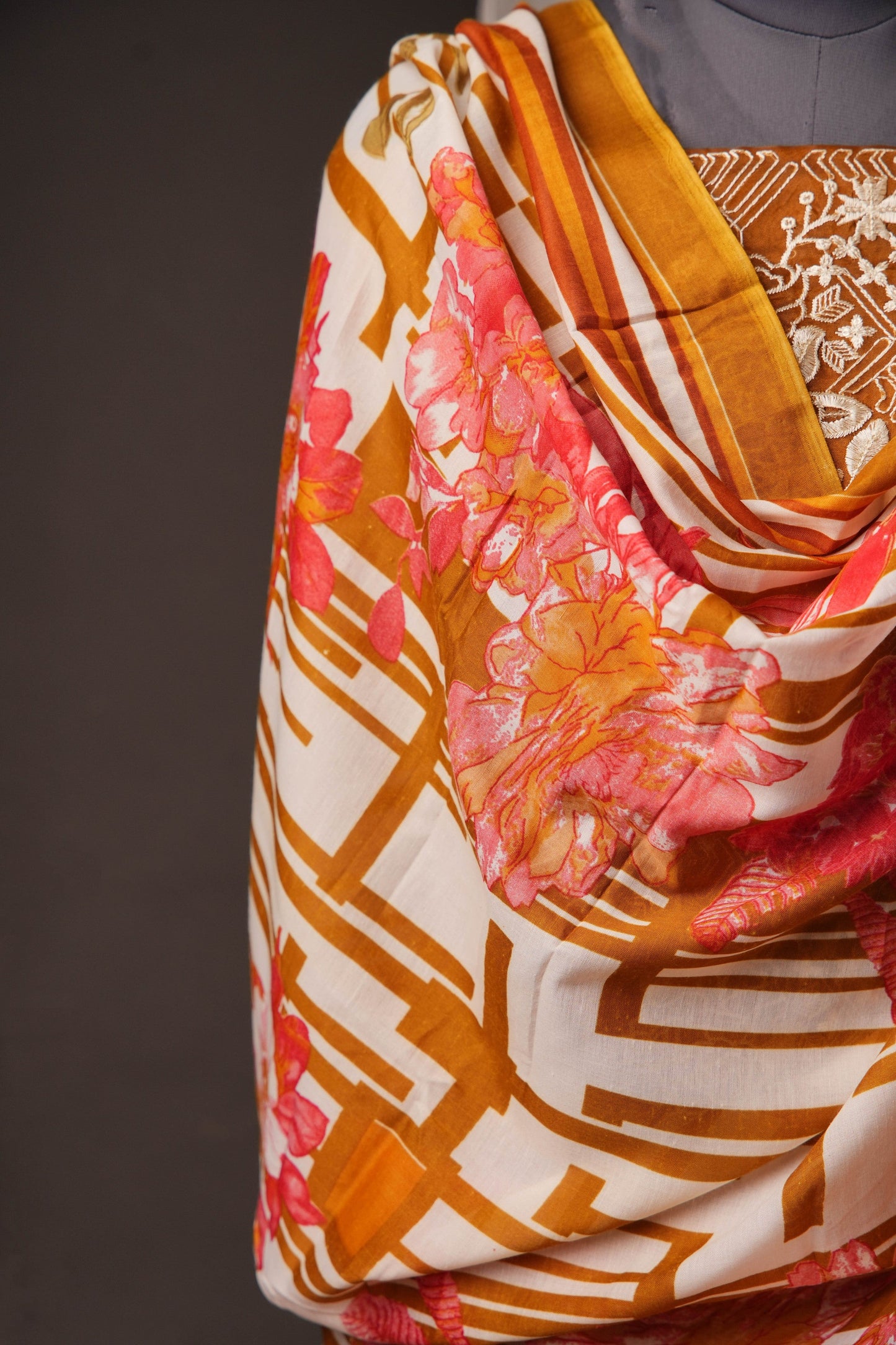 Rust Orange Pakistani Unstitched Suit with Embroidered Neck Patch & Dual Sleeve Borders.