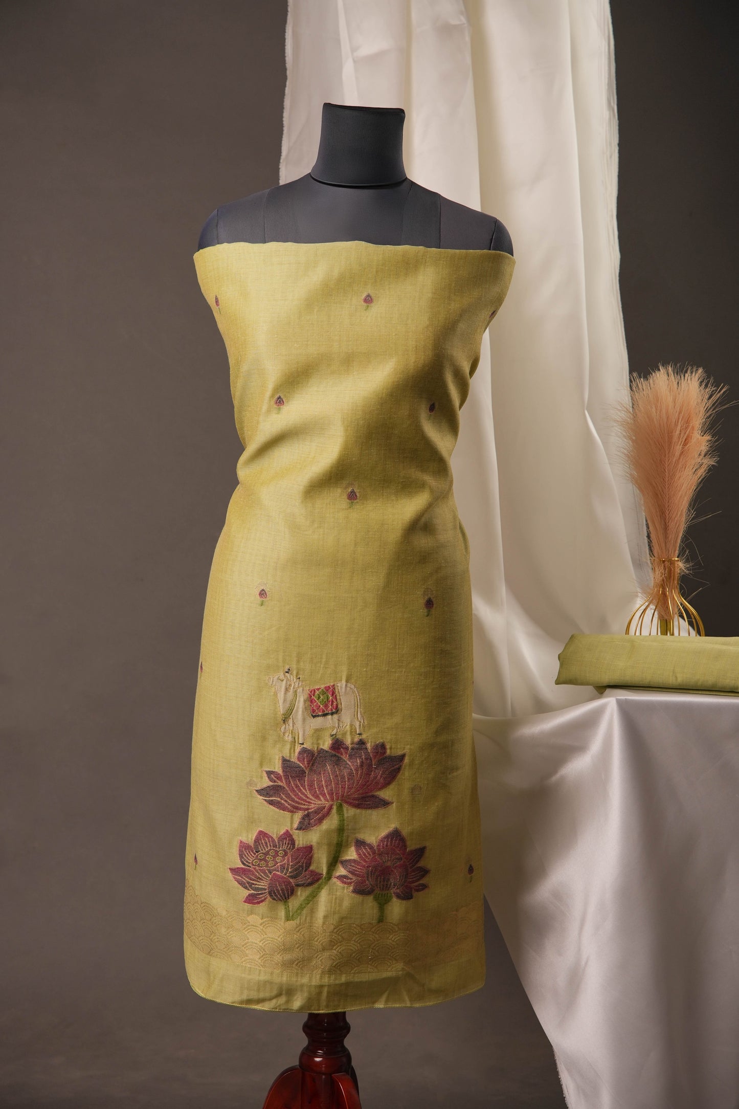 Lotus Floral Pista Green Muga Cotton Unstitched Suit with Lotus & Cow Weaving and Tassel Dupatta