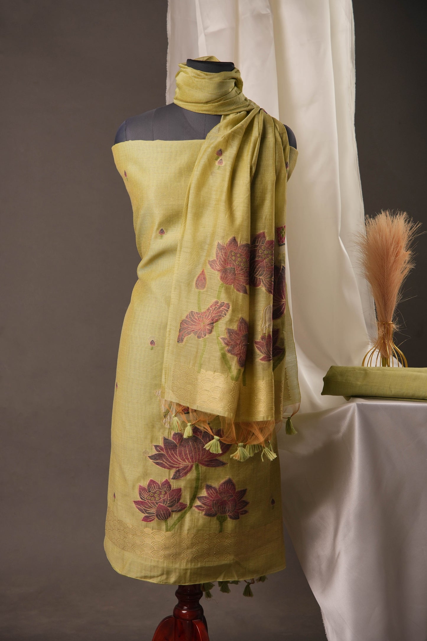 Lotus Floral Pista Green Muga Cotton Unstitched Suit with Lotus & Cow Weaving and Tassel Dupatta