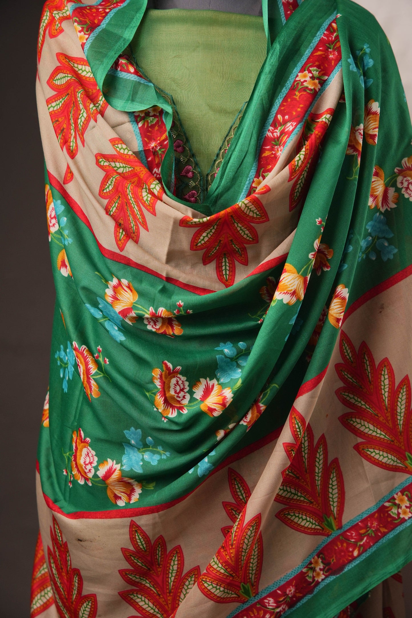 Green Pakistani Unstitched Suit with Embroidered Neck Patch & Puff Sleeve.