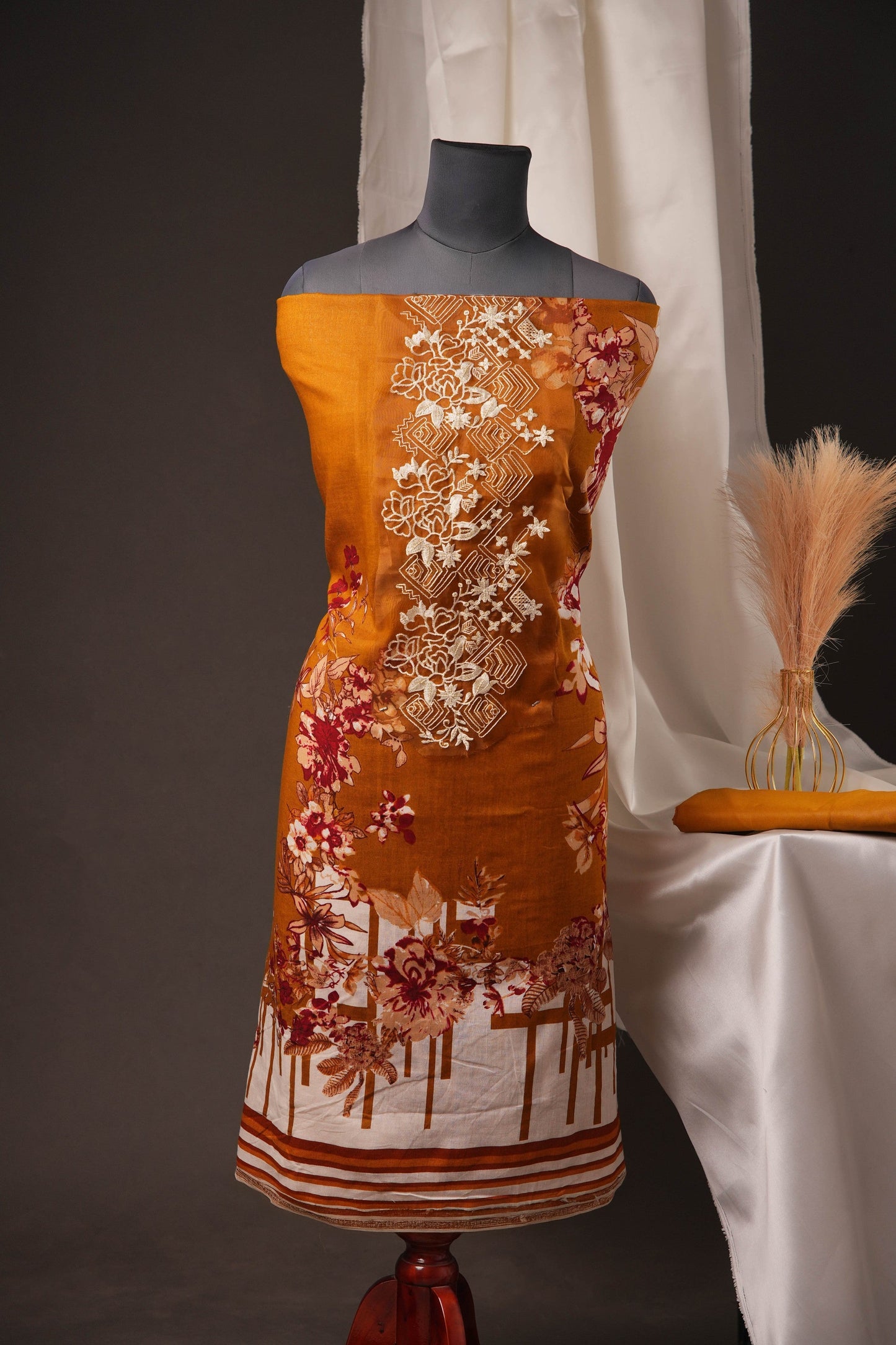 Rust Orange Pakistani Unstitched Suit with Embroidered Neck Patch & Dual Sleeve Borders.