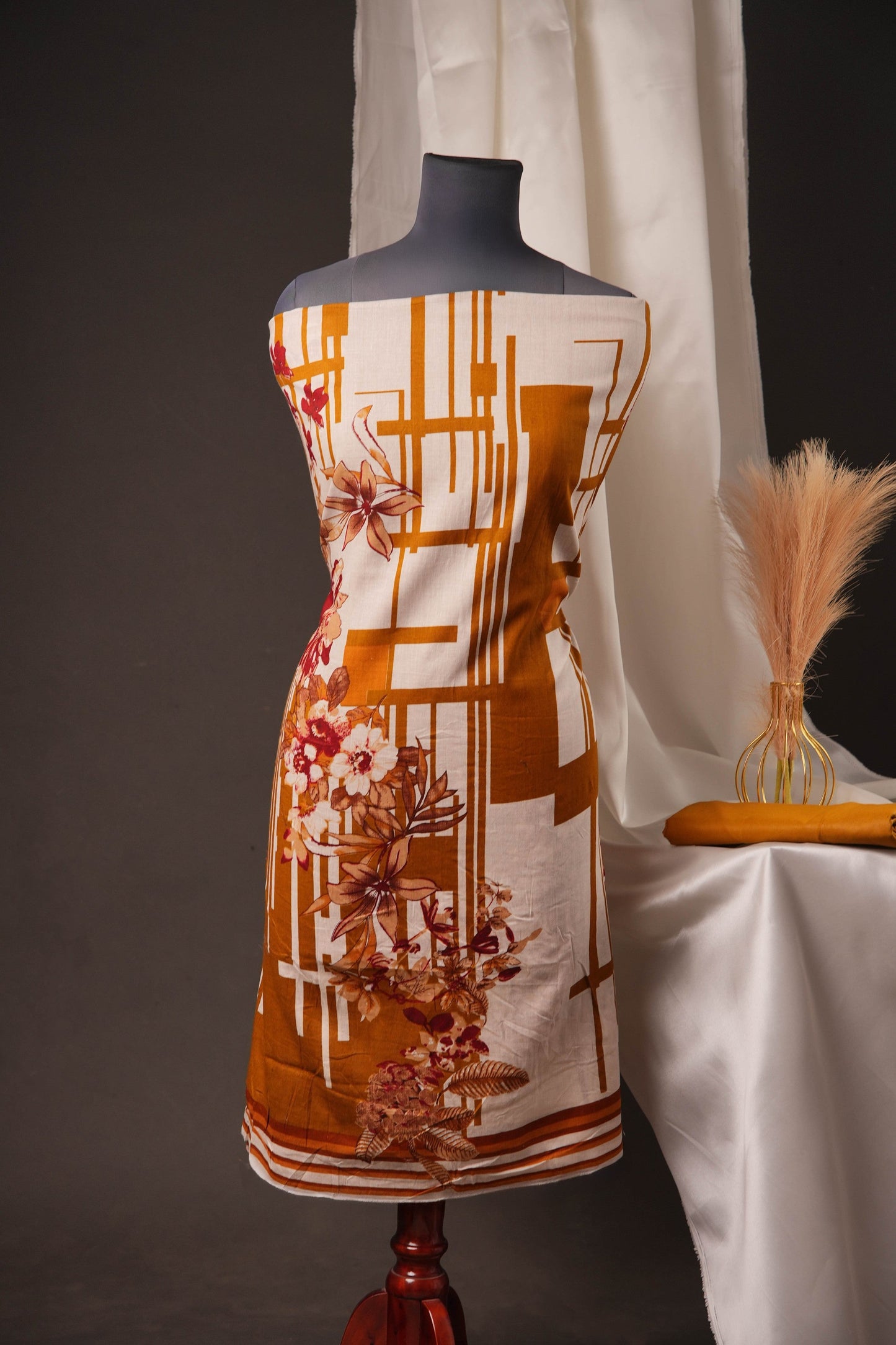 Rust Orange Pakistani Unstitched Suit with Embroidered Neck Patch & Dual Sleeve Borders.